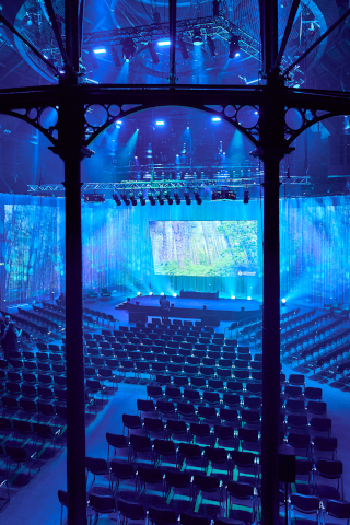 Conference furniture hire in London featuring rows of interlinking conference chairs and accessories  for corporate events.